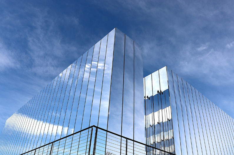 A mirrored building representing mirrored commercial interior design